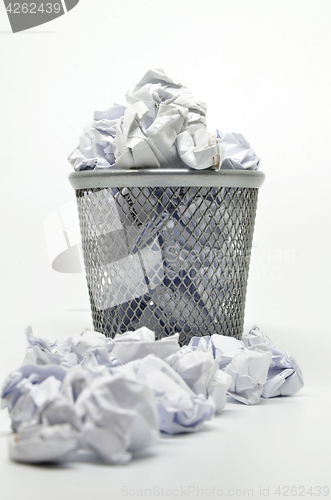 Image of Garbage bin with paper waste