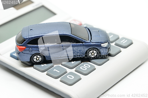 Image of Calculator and toy car 