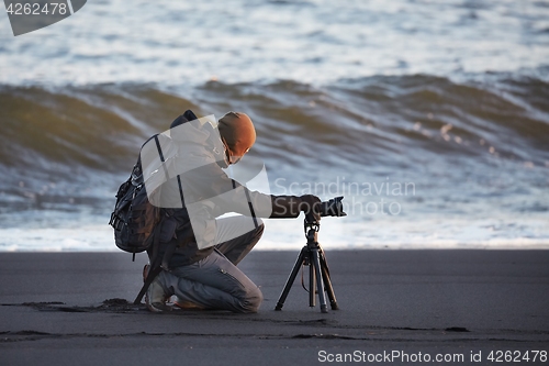 Image of Photographer with tripod