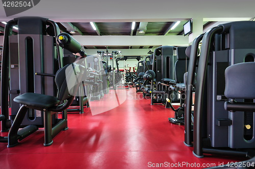 Image of Modern gym interior with equipment