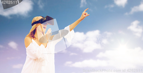 Image of amazed woman in virtual reality headset 