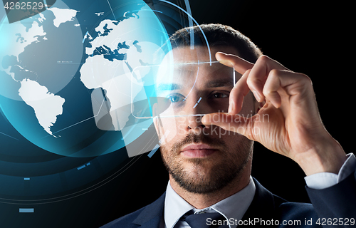 Image of businessman with smartphone and virtual globe