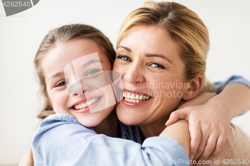 Image of happy smiling family hugging