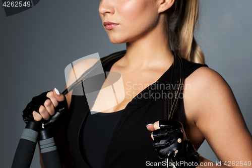 Image of close up of sporty woman with jumping rope