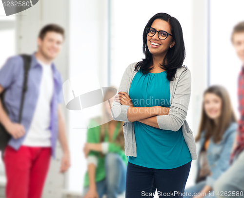 Image of happy smiling young indian woman in glasses