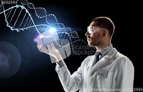 Image of scientist in lab coat and safety glasses with dna