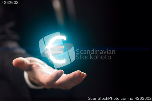 Image of Man hand l with euro icon