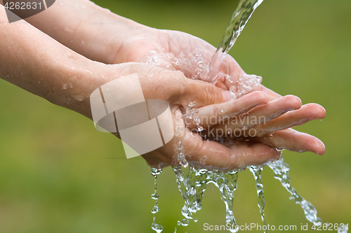 Image of closeup of woman washing her hands