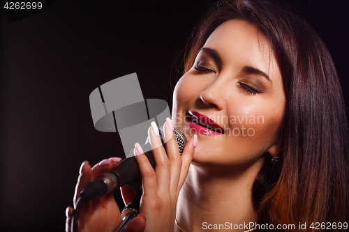 Image of Singing girl on empty background