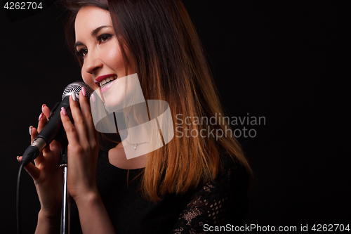 Image of Girl with microphone in hands