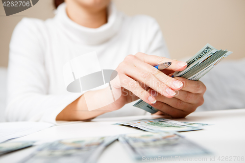 Image of Hands counting money, close up