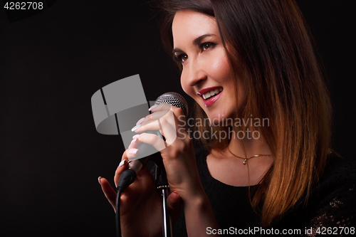 Image of Girl with microphone in hands