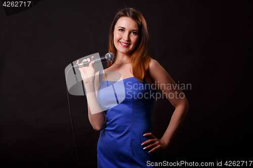 Image of Smiling woman in blue dress