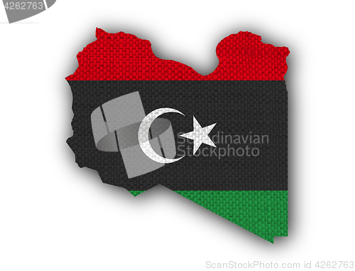 Image of Map and flag of Libya on old linen