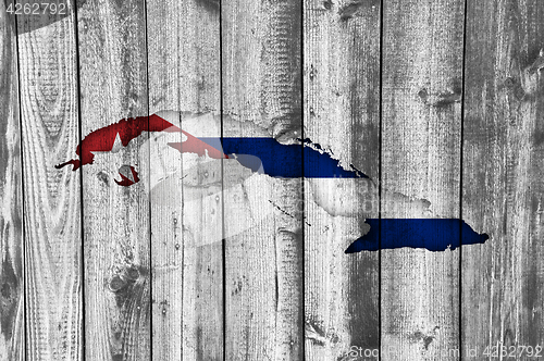 Image of Map and flag of Cuba on weathered wood