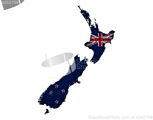 Image of Map and flag of New Zealand on poppy seeds,
