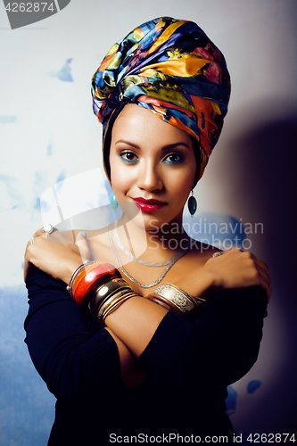 Image of beauty bright african woman with creative make up, shawl on head