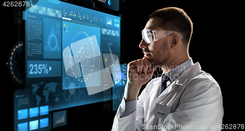 Image of scientist in goggles looking at virtual screen
