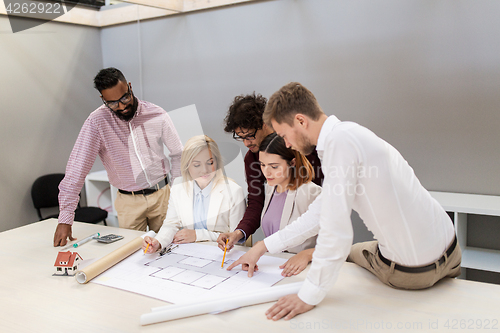 Image of business team discussing house project at office