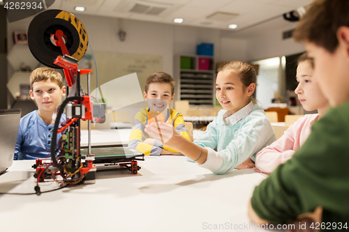 Image of happy children with 3d printer at robotics school