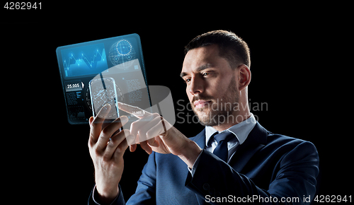 Image of businessman with smartphone and virtual screen
