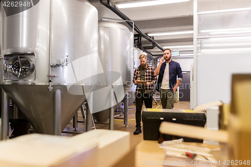 Image of men working at craft brewery or beer plant