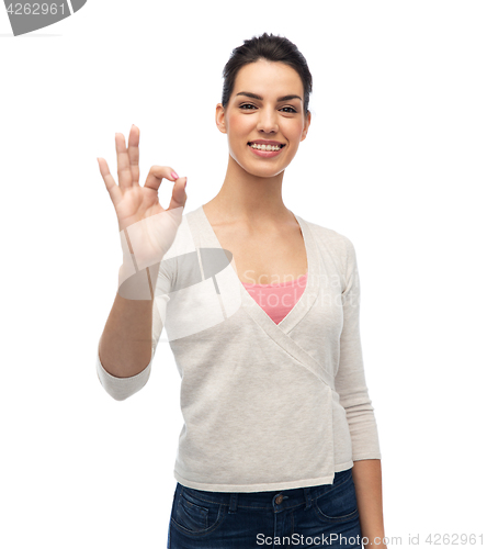 Image of happy smiling woman with braces showing ok