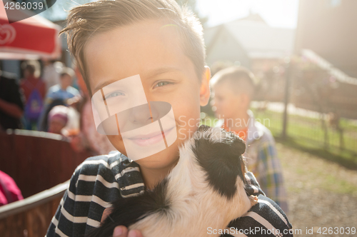 Image of happy smiling boy with cavy