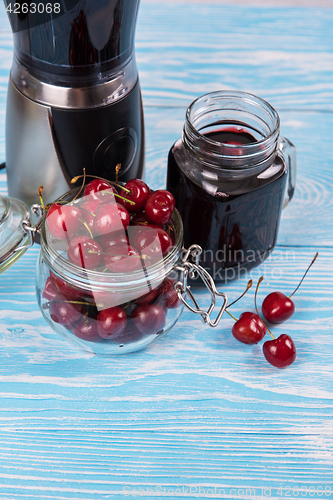 Image of Cherry juice with glass of berries