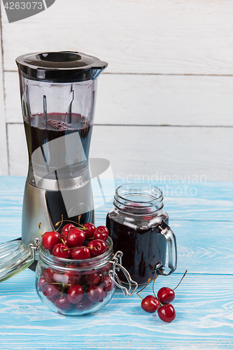 Image of Cherry juice with glass of berries