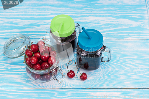 Image of Cherry juice with glass of berries