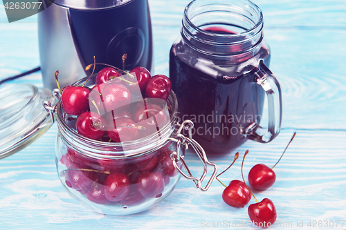 Image of Cherry juice with glass of berries