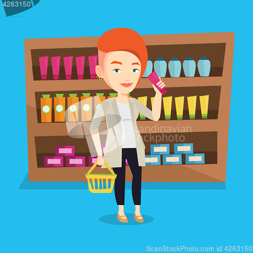 Image of Customer with shopping basket and tube of cream.