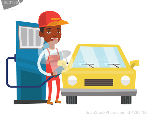 Image of Worker filling up fuel into car.