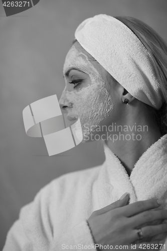 Image of Spa Woman applying Facial Mask