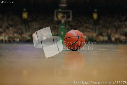 Image of basketball ball and net on black background