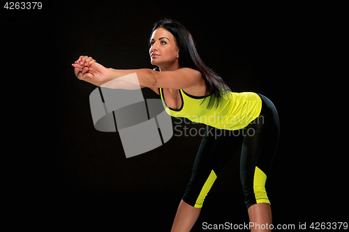 Image of The woman training against black studio