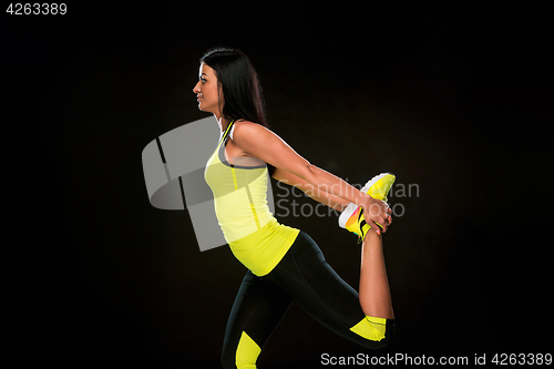 Image of The woman training against black studio