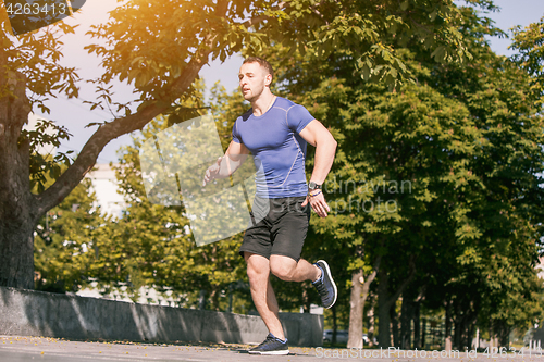 Image of Man running in park at morning. Healthy lifestyle concept