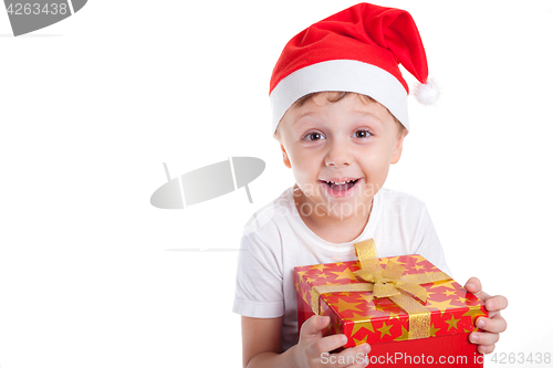 Image of Happy little smiling boy with christmas gift box.