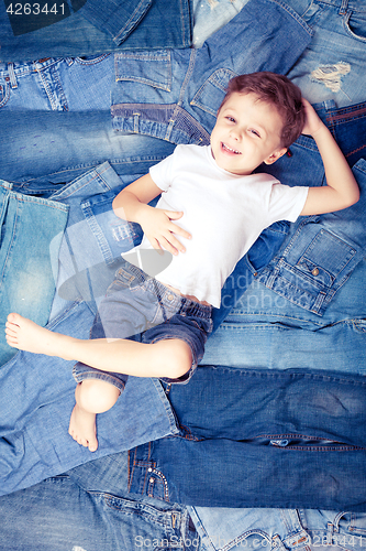 Image of Cute little boy  the background jeans.