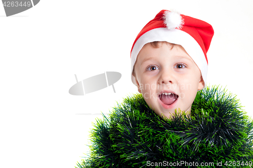 Image of Happy little smiling boy with christmas hat.