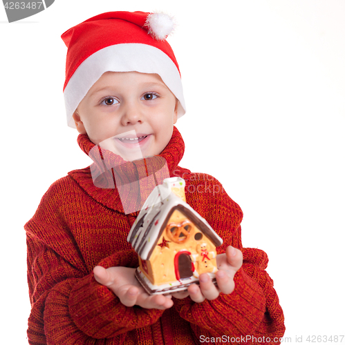 Image of Happy little smiling boy with christmas hat.