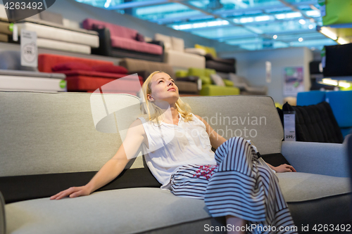 Image of Woman shopping for furniture, sofa and home decor in store