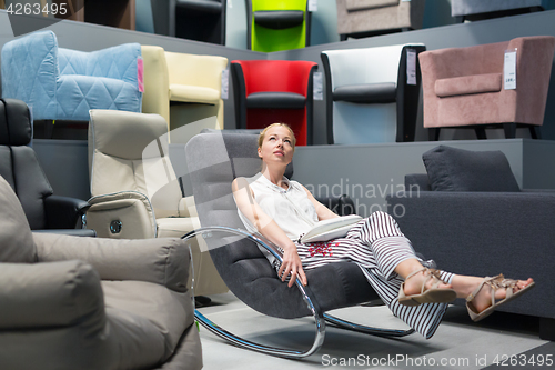 Image of Woman shopping for furniture, sofa and home decor in store