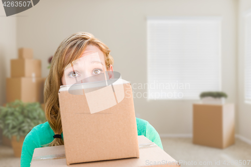 Image of Happy Young Adult Woman Holding Moving Boxes In Empty Room In A 