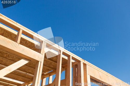 Image of Wood Home Framing Abstract At Construction Site.