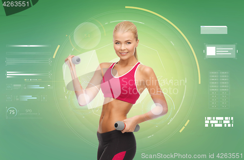 Image of happy sporty woman with dumbbells flexing biceps