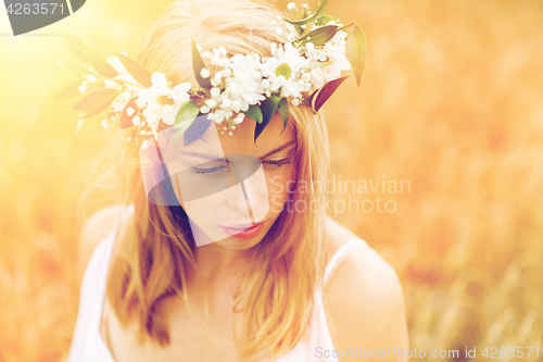 Image of happy woman in wreath of flowers