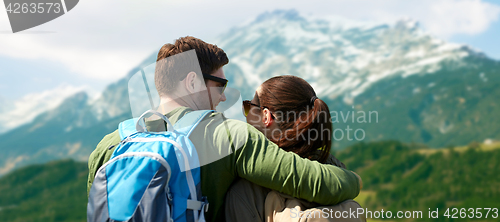 Image of happy couple with backpacks traveling